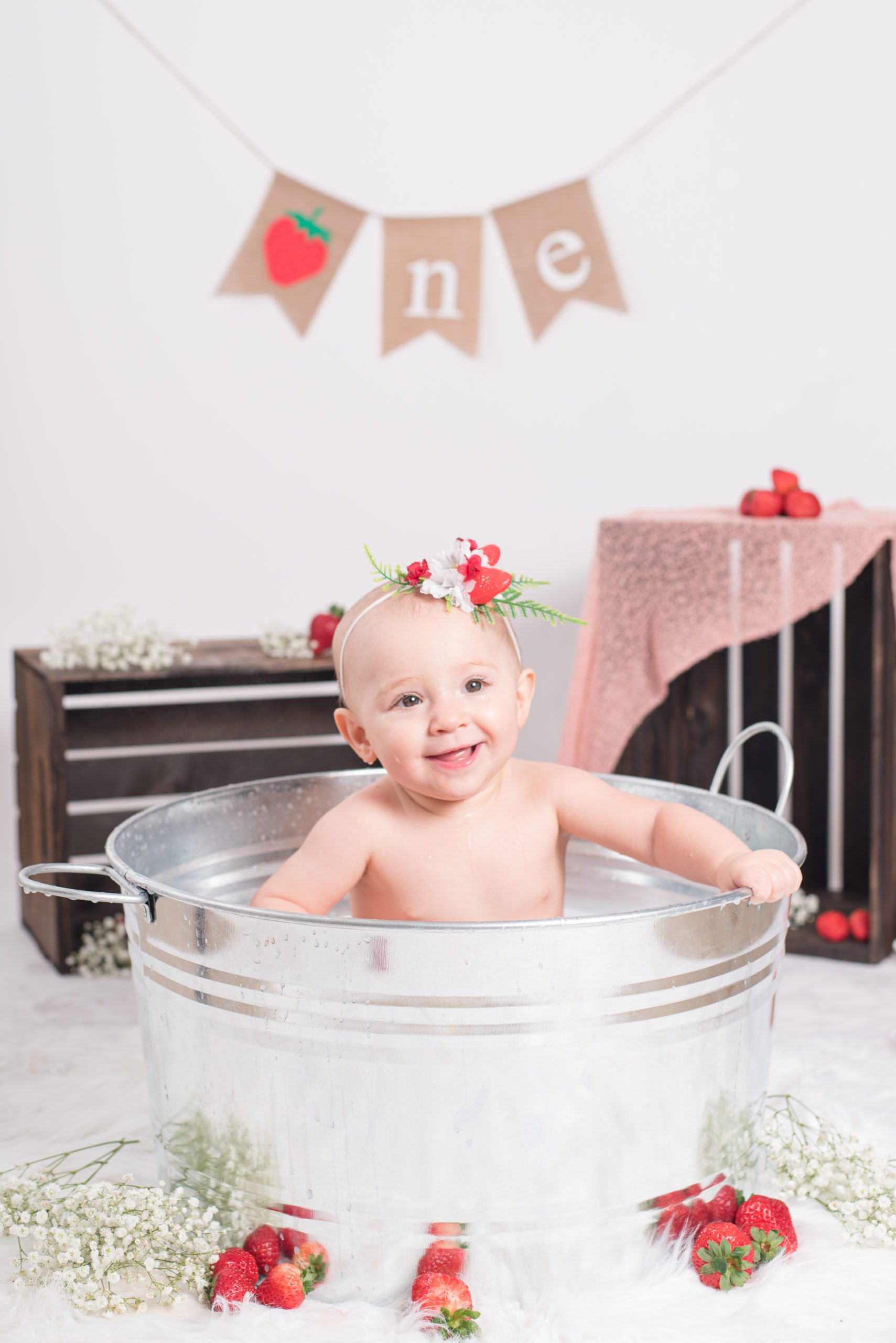 Taking a strawberry bath after Annessa's first year cake smash