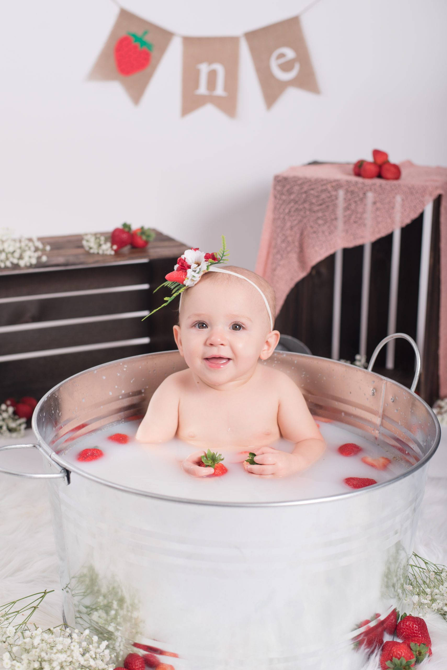 Taking a strawberry bath after Annessa's first year cake smash