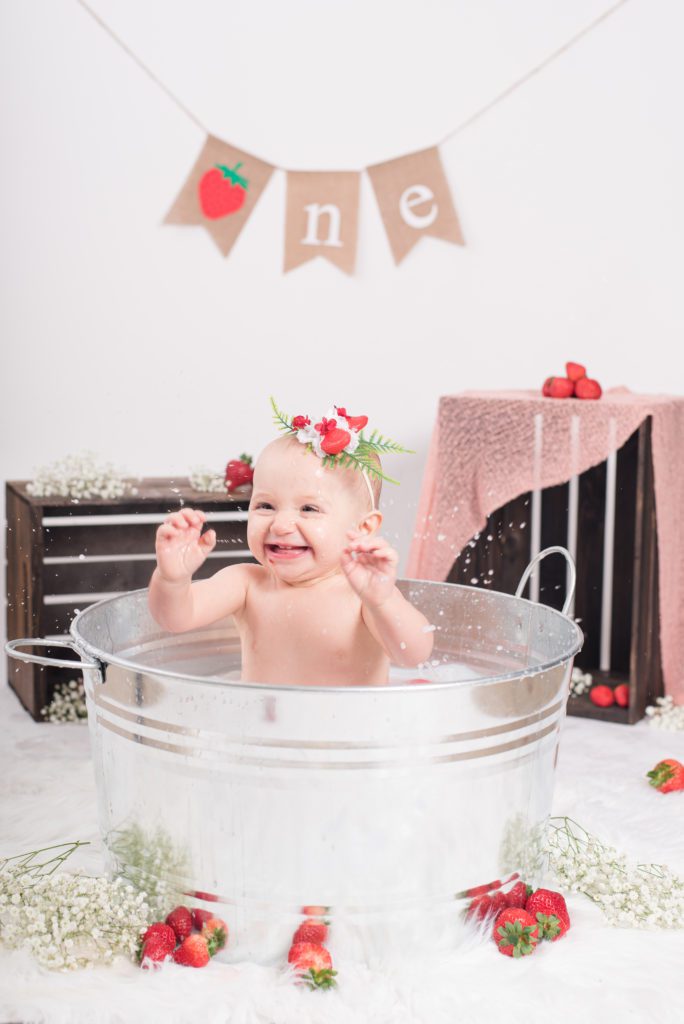 Taking a strawberry bath after Annessa's first year cake smash