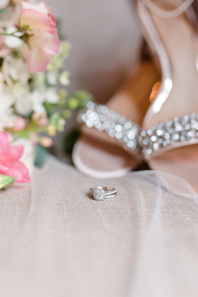 Detail shot of wedding bouquet with shoes and ring