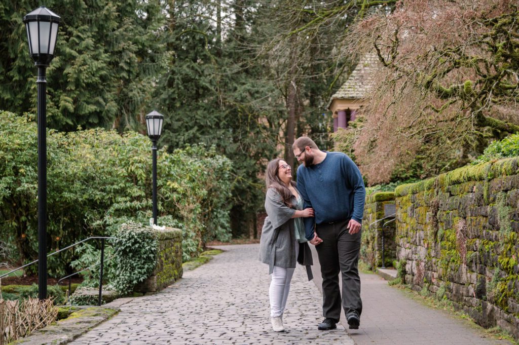 Engaged couple walking along path