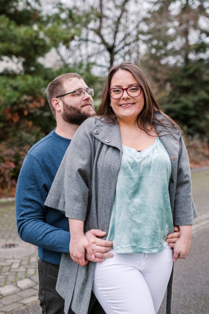 Engaged couple holding each other