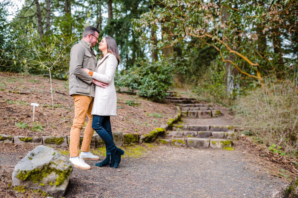 Engaged couple standing on stairs