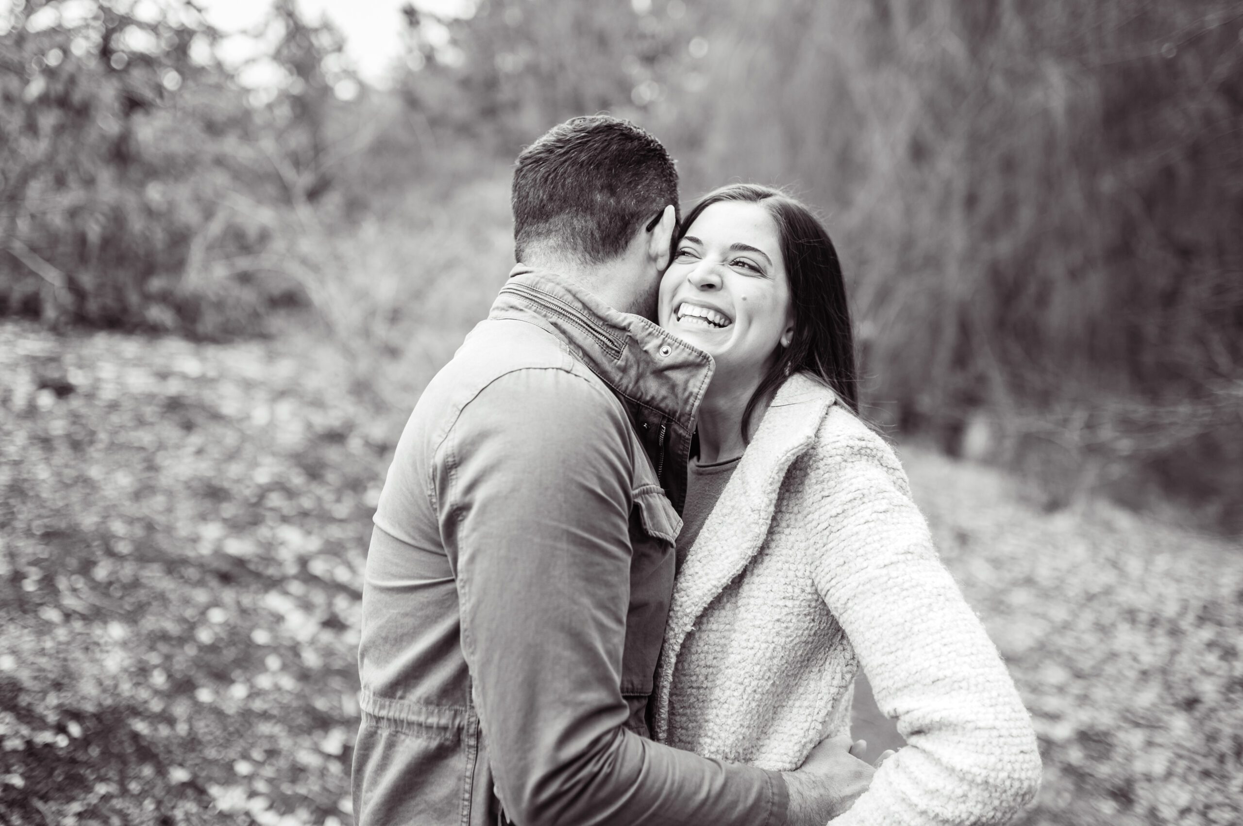 Engaged couple laughing