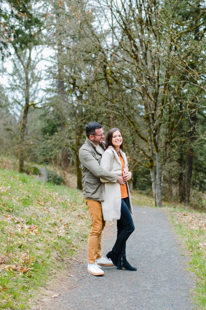 Engaged couple hugging