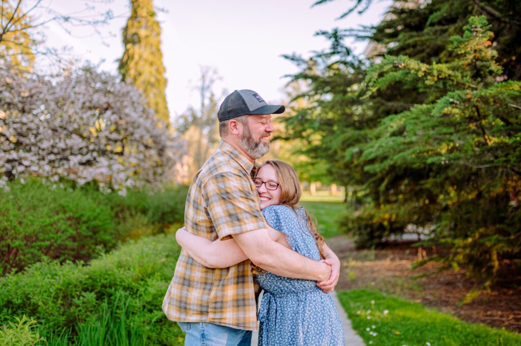 Engaged couple hugging and smiling