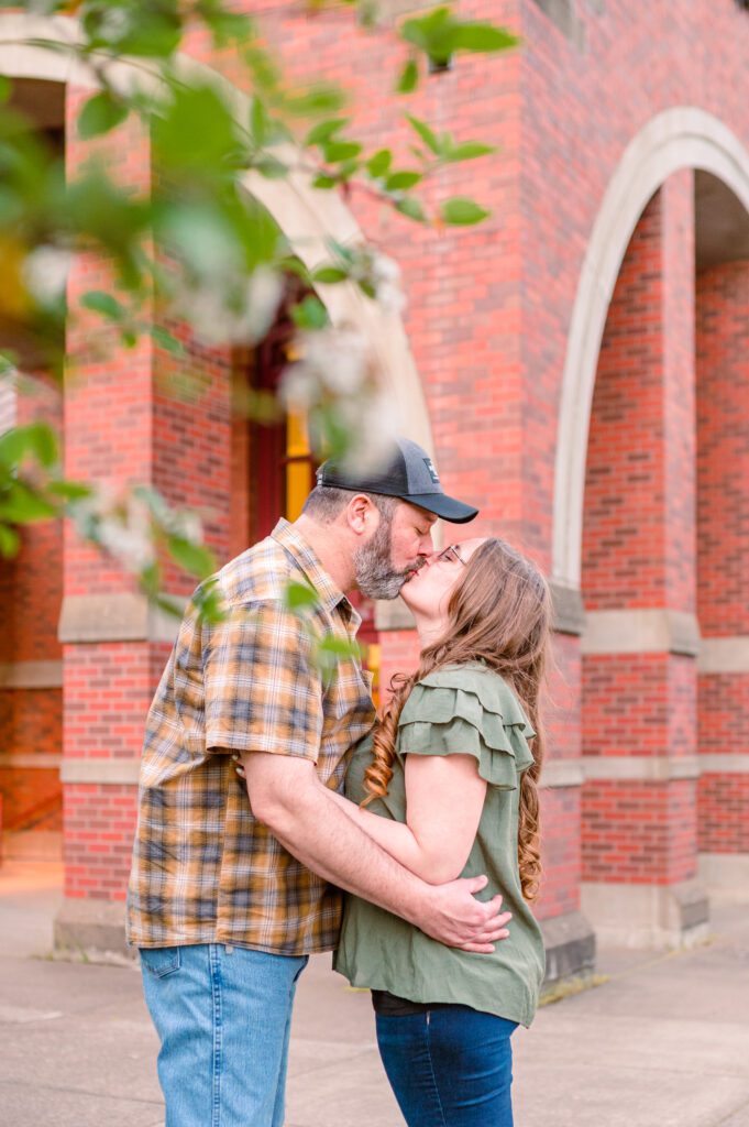 Engaged couple kissing