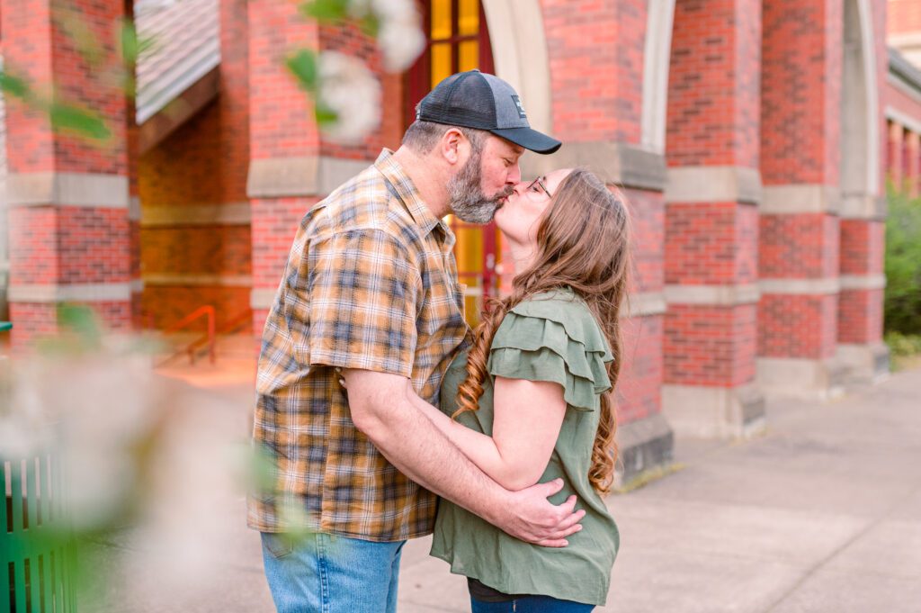 Engaged couple kissing