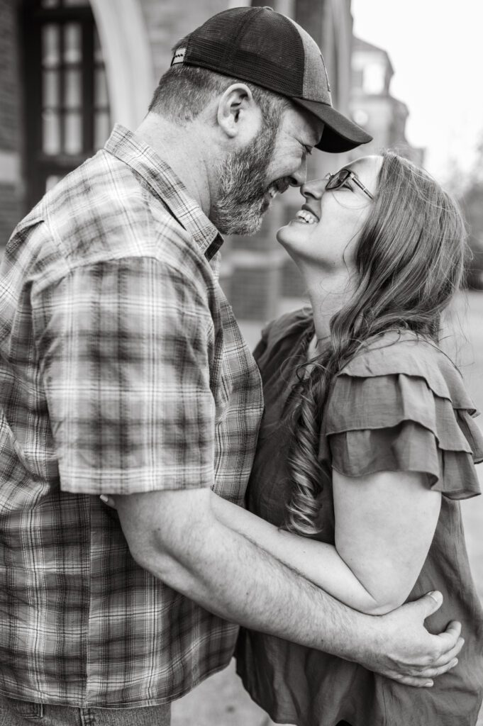 Engaged couple nose to nose and smiling