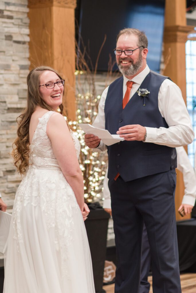 Bride and groom laughing during their wedding ceremony in Oregon