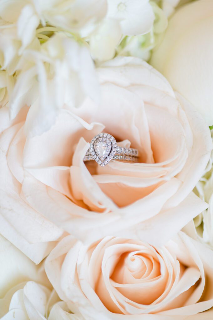 Brides wedding and engagement ring in her rose bouquet at her wedding at East Fork Country Estate in Damascus Oregon