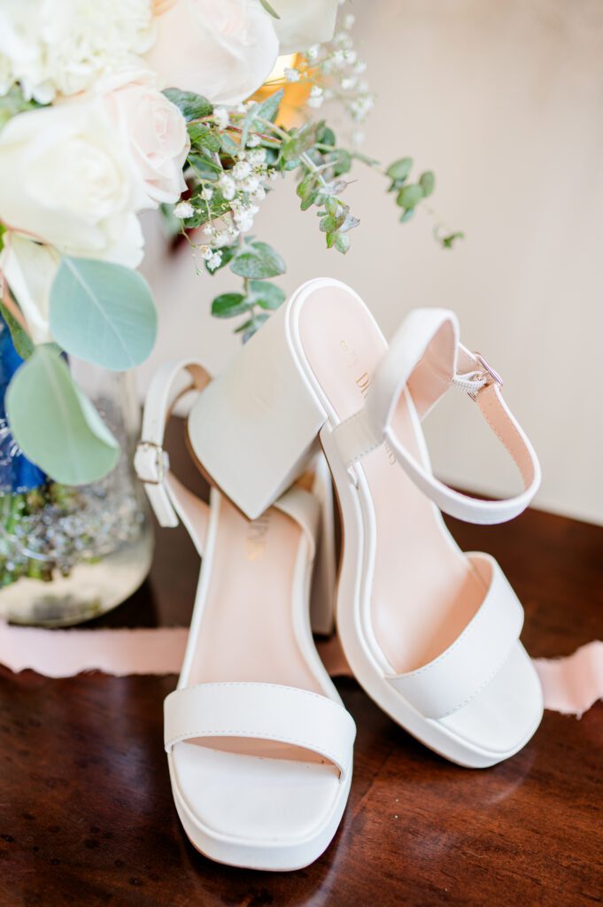 Brides wedding shoes and bouquet at East Fork Country Estate in Damascus Oregon