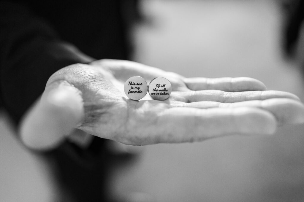 Father of the bride holding his custom cuff links at East Fork Country Estate in Damascus Oregon