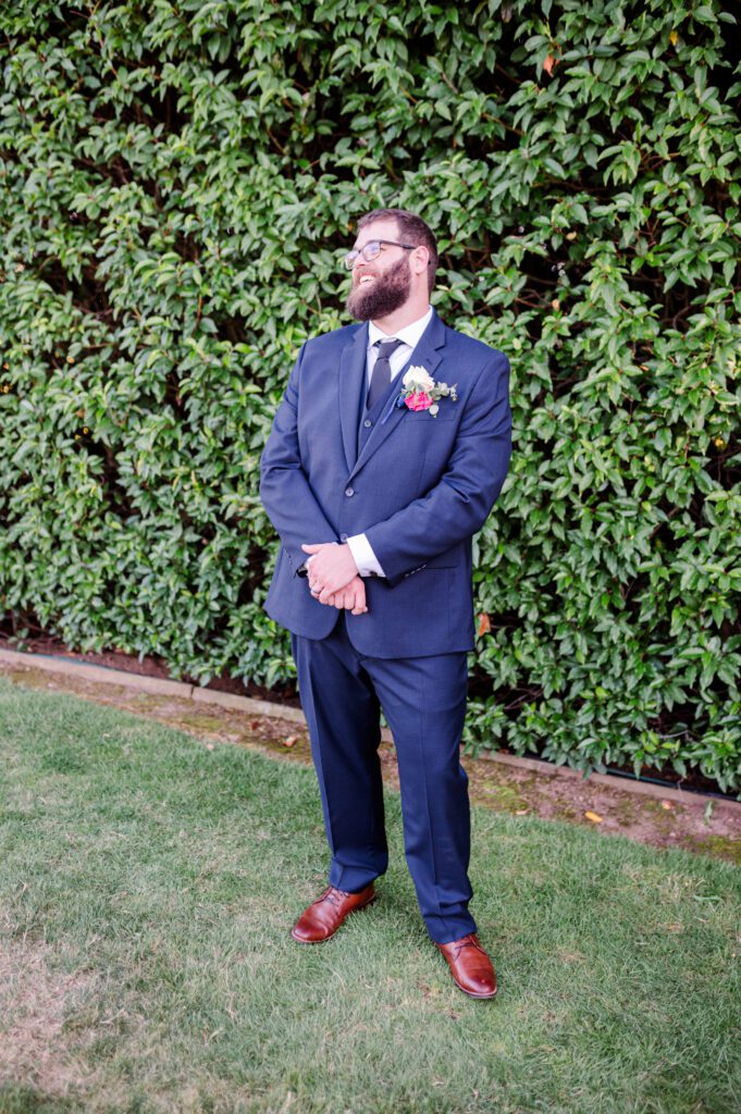 Groom posing outside his venue at East Fork Country Estate in Damascus Oregon