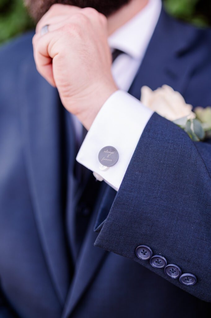 Groom shows off his custom cuff links outside of his wedding venue at East Fork Country Estate in Damascus Oregon