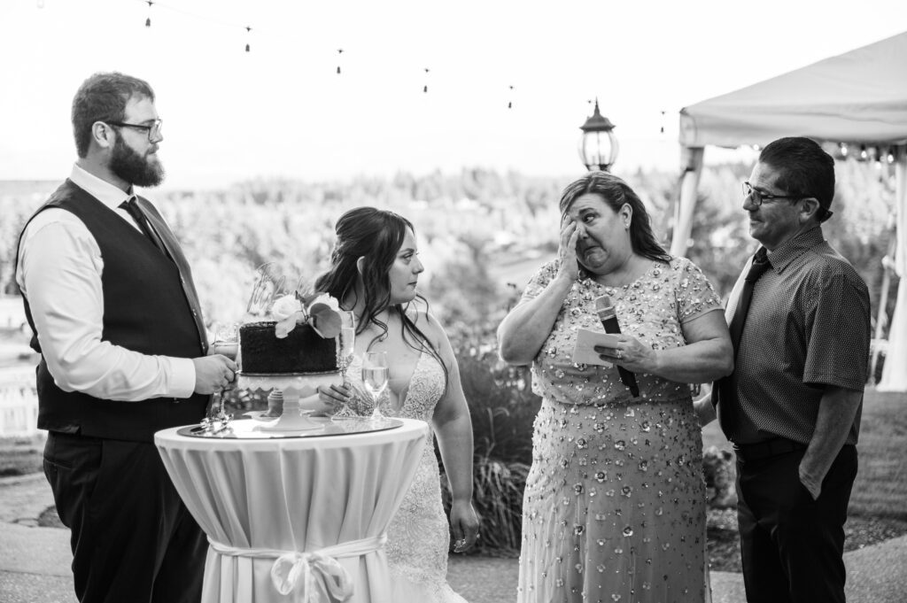 Brides parents toast the new couple at their wedding reception at East Fork Country Estate in Damascus Oregon