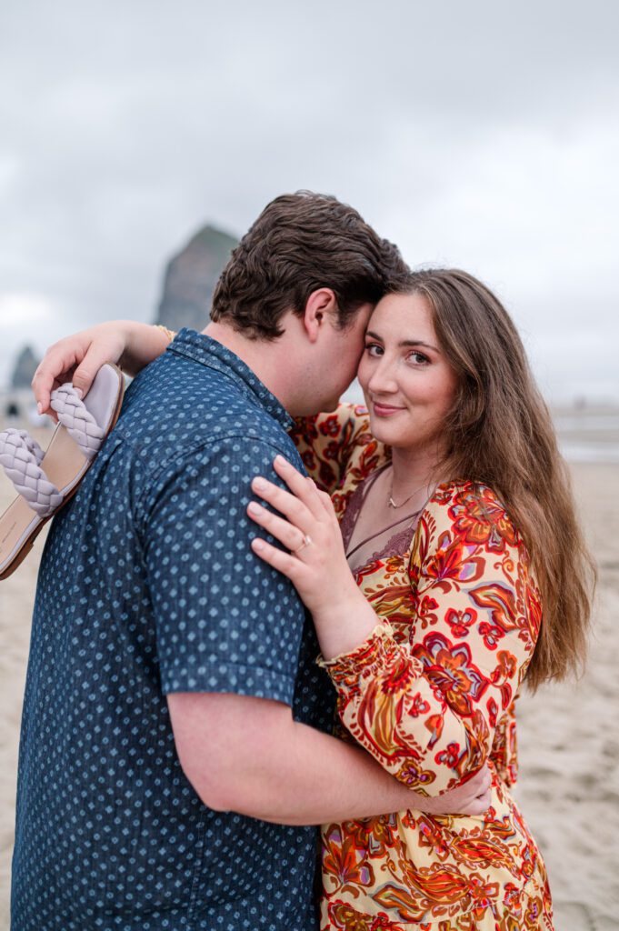 Bride smiling at camera during their Cannon Beach engagement session in Oregon